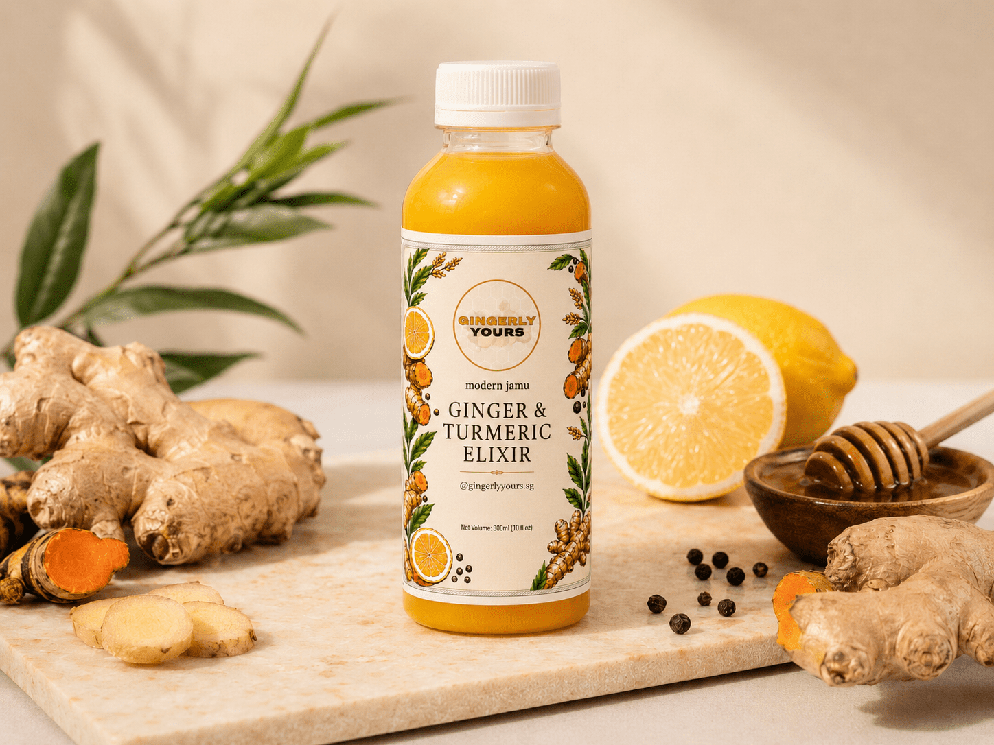Gingerly Yours 300ml ginger and turmeric elixir bottle styled with fresh ginger, turmeric, lemon, honey, and black pepper on a warm cream background.