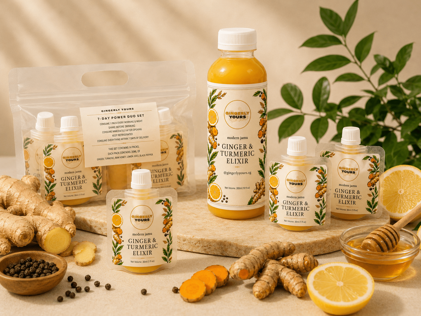 Gingerly Yours Ginger and Turmeric Elixir Product Range Gingerly Yours ginger and turmeric elixir bottle and pouches arranged with fresh ginger, turmeric, lemon, honey, and black pepper on a warm cream background.